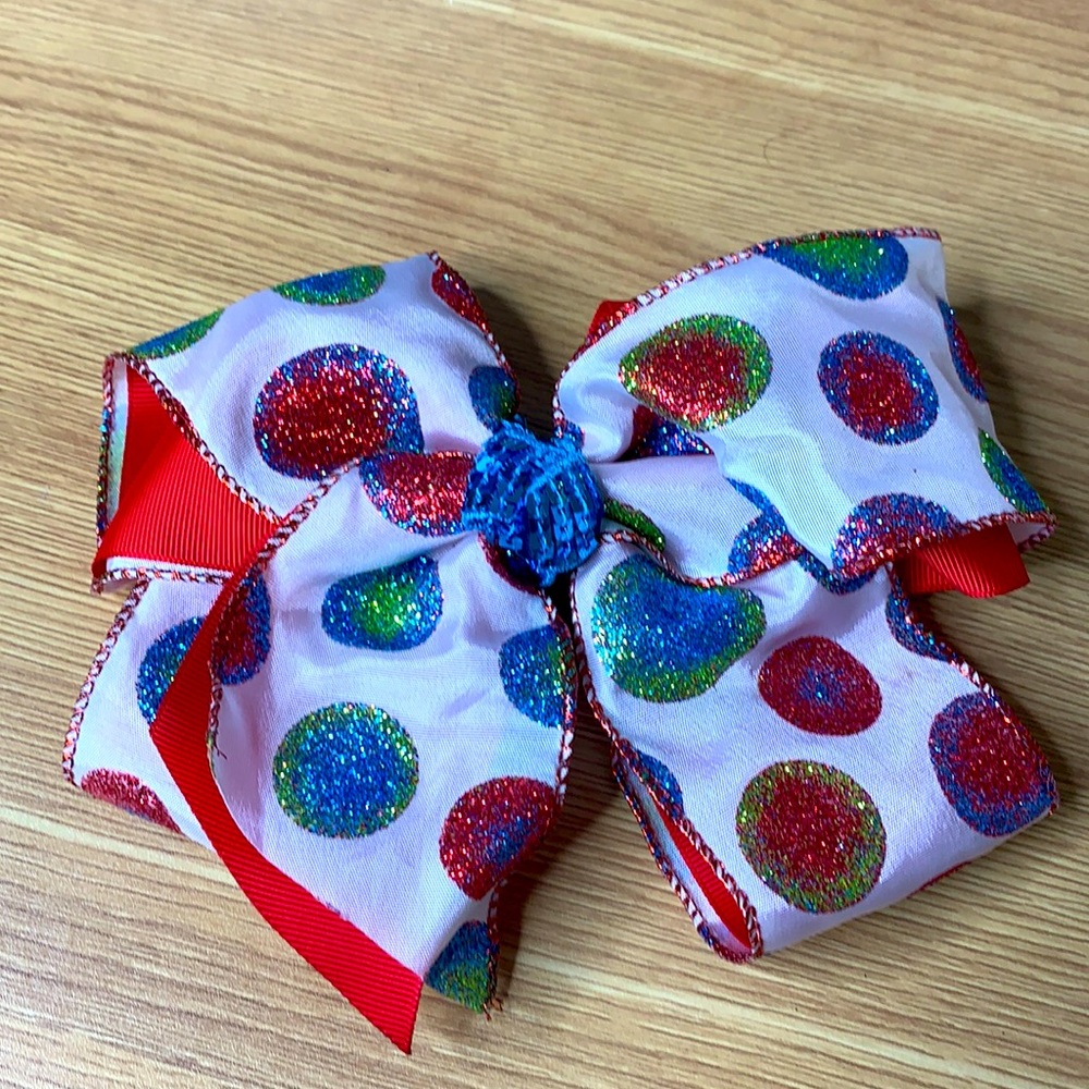 One bow.Green blue white red. Glitter and sequins.